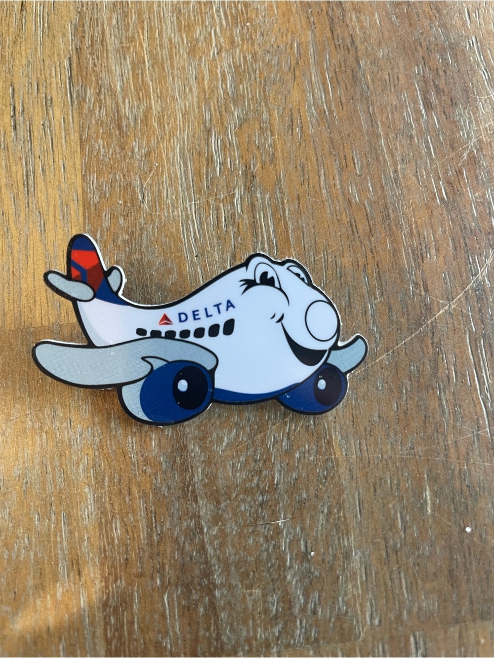 Delta White & Blue Smiling Cartoon Airplane Pin